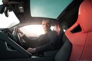 male model sits in the drivers seat Jaguar F-Type R, advertising photography by Seagram Pearce automotive